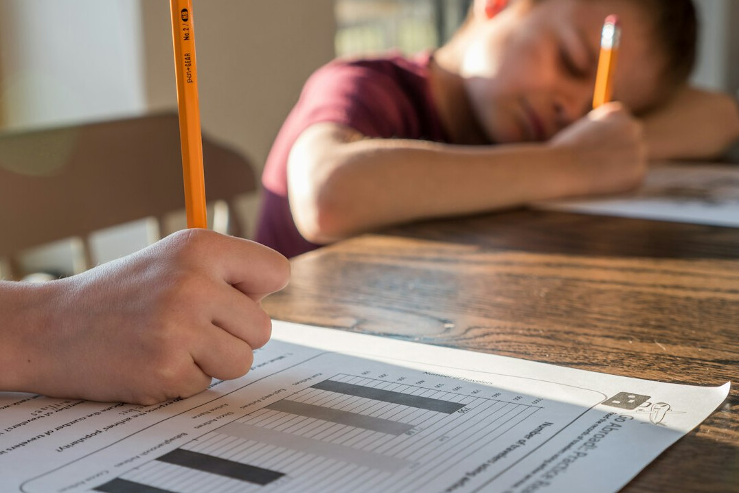 Person filling out a paper questionnaire